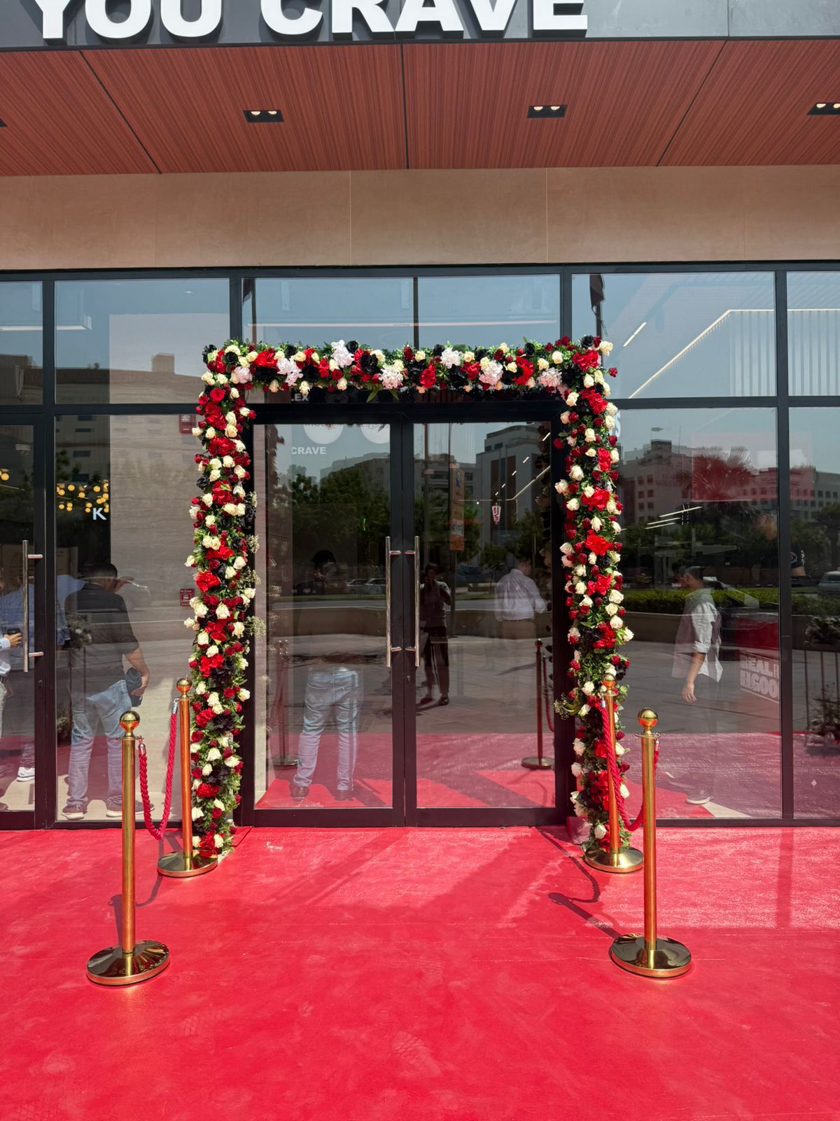 Floral venue entry with red carpet